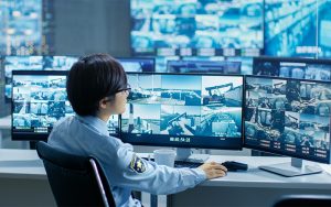 Apollo Global Academy student monitoring CCTV feeds in control room