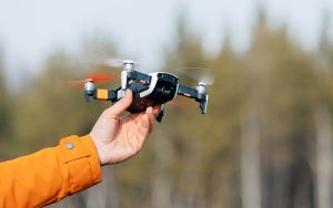 Beginner launching an easy-to-fly drone by hand outdoors